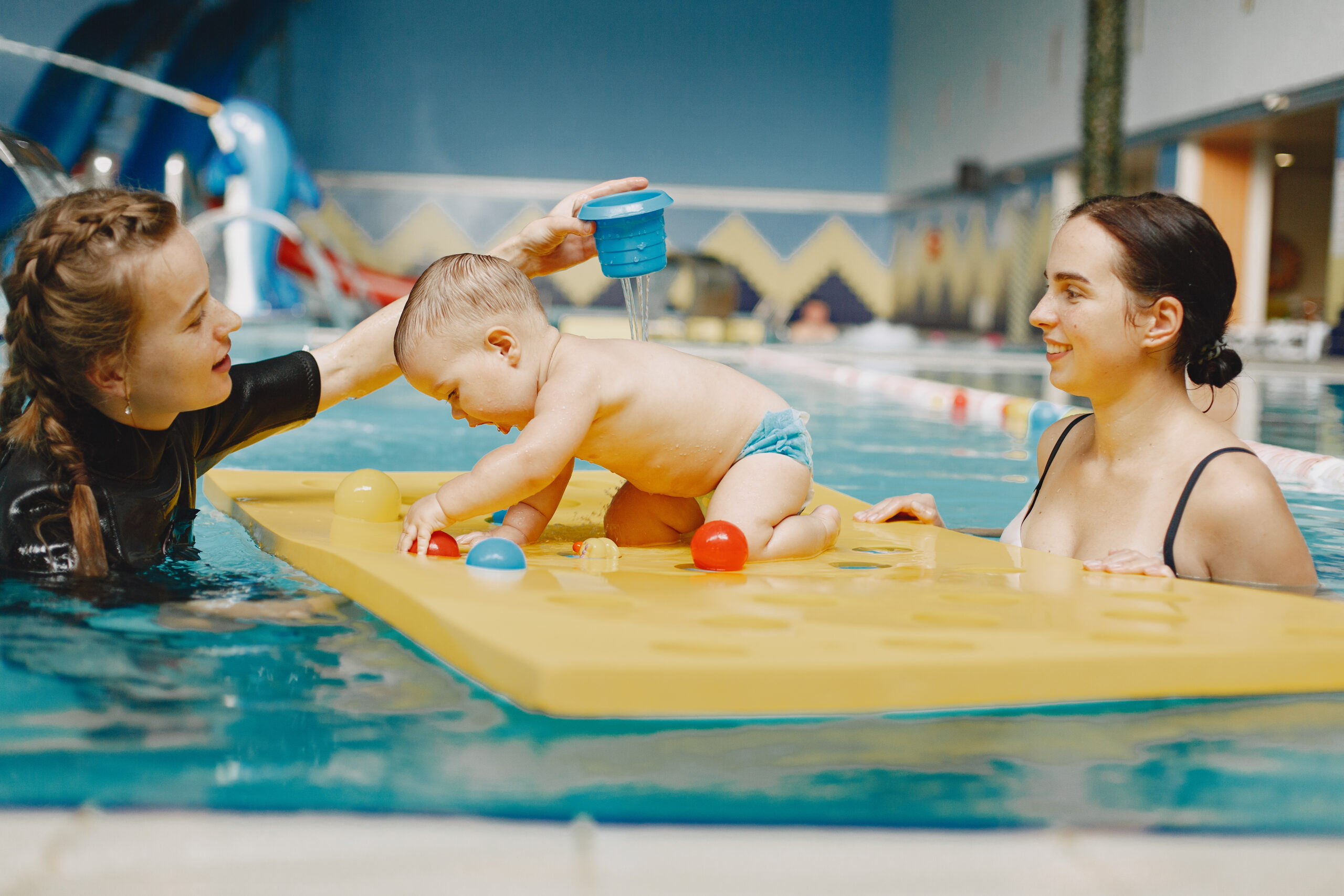 Little cute baby boy. Instructor with kid. Mother with son.