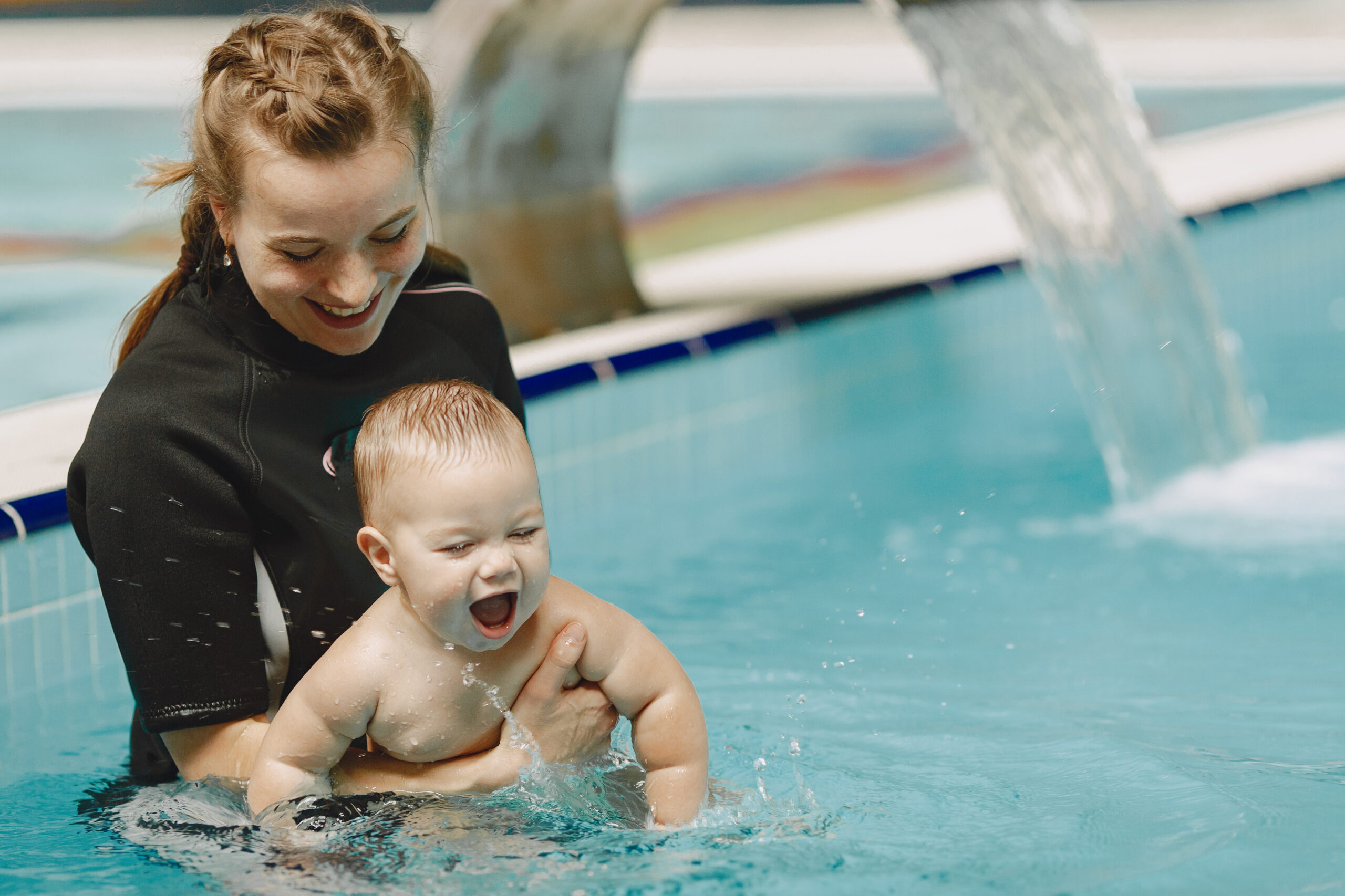 Little cute baby boy. Instructor with kid. Mother with son.